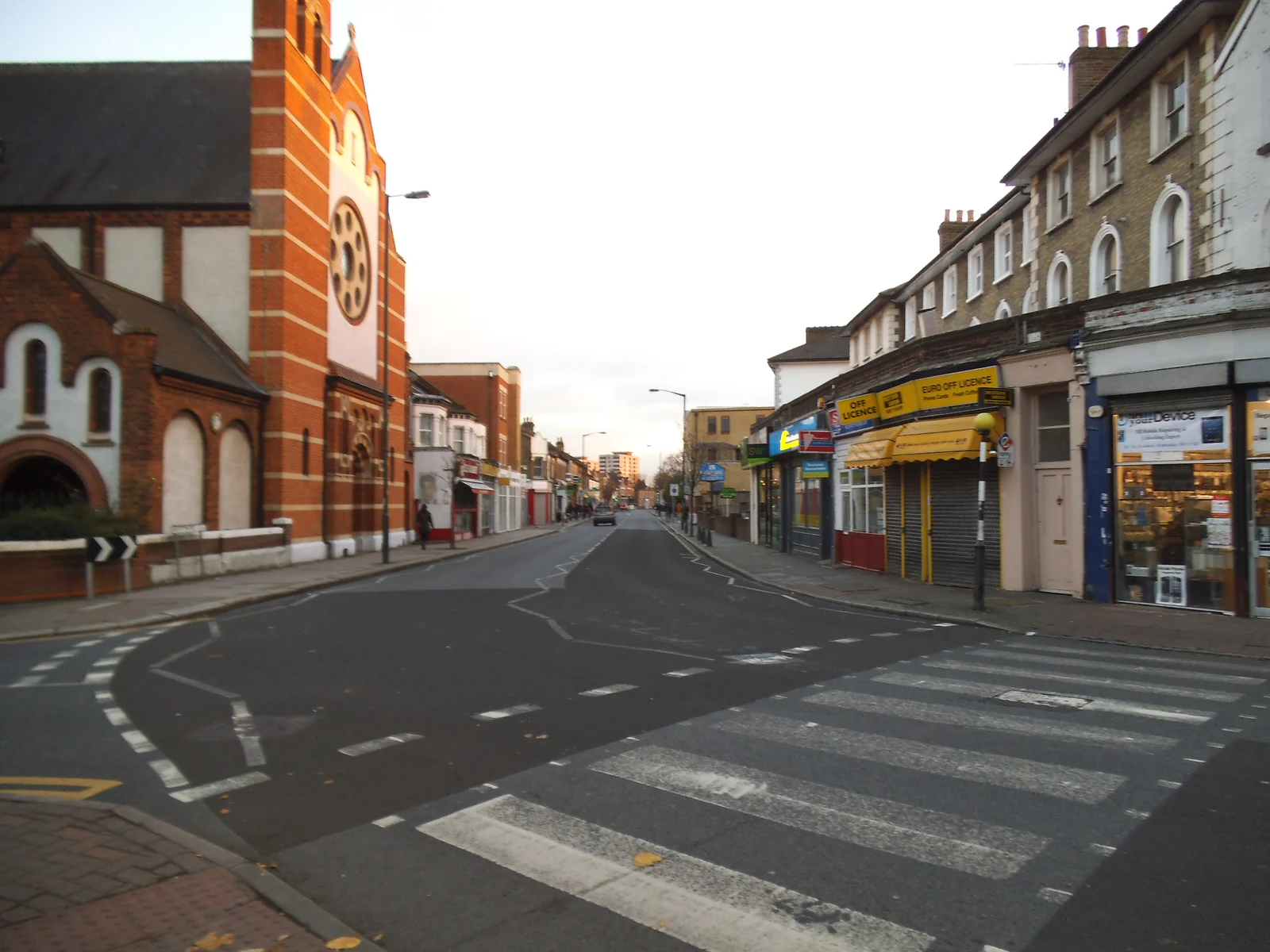 Archive view along Merton Road in Wimbledon showing local shops and a pedestrian crossing