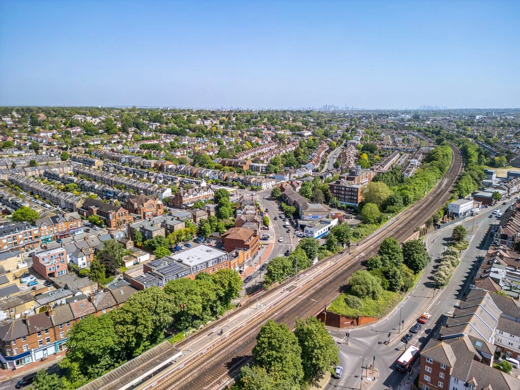 Aerial view of Wimbledon housing, leafy streets and railway lines